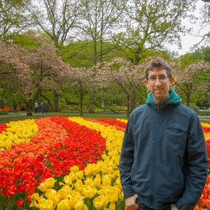 Me with orange, yellow, and red tulips