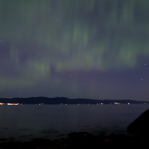 Northern lights over the water